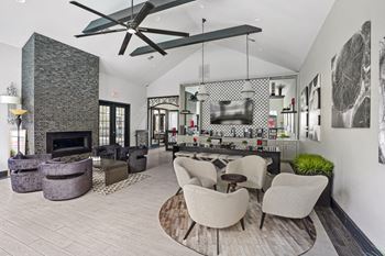 Community lounge & co-working space with fireplace and kitchen